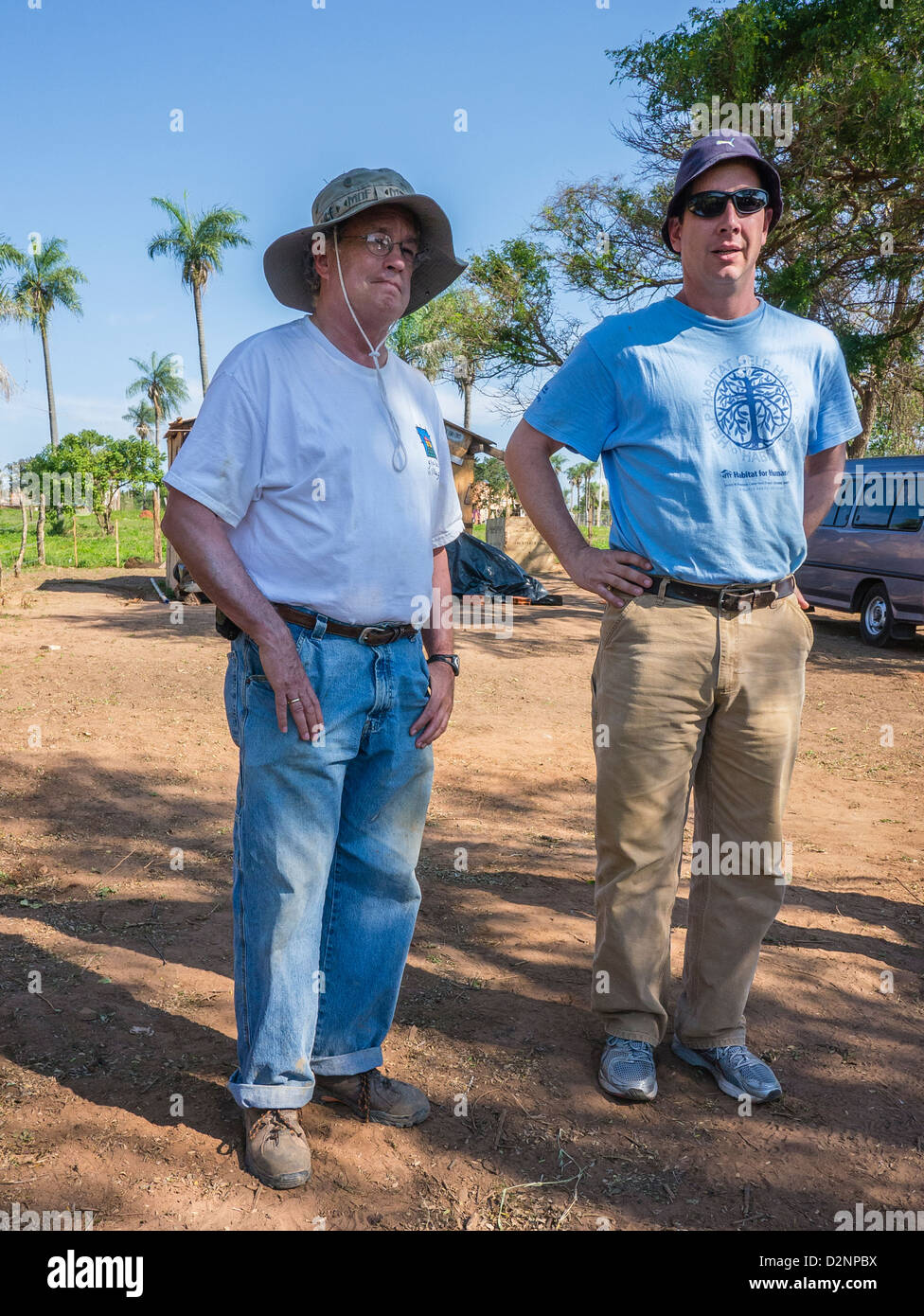 Two team leaders of the adult volunteers for Habitat for Humanity on the work site in Luque, Paraguay. Stock Photo