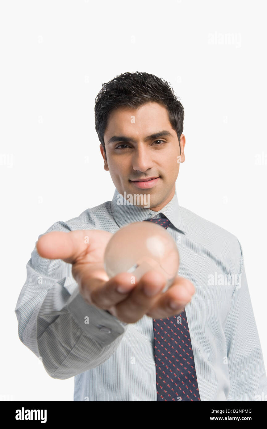 Businessman looking into crystal ball hi-res stock photography and ...