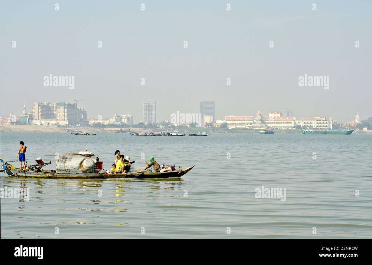 Floating village on the Mekong river in Phnom Penh , 500 meters from some of the most expensive city hotels. Stock Photo