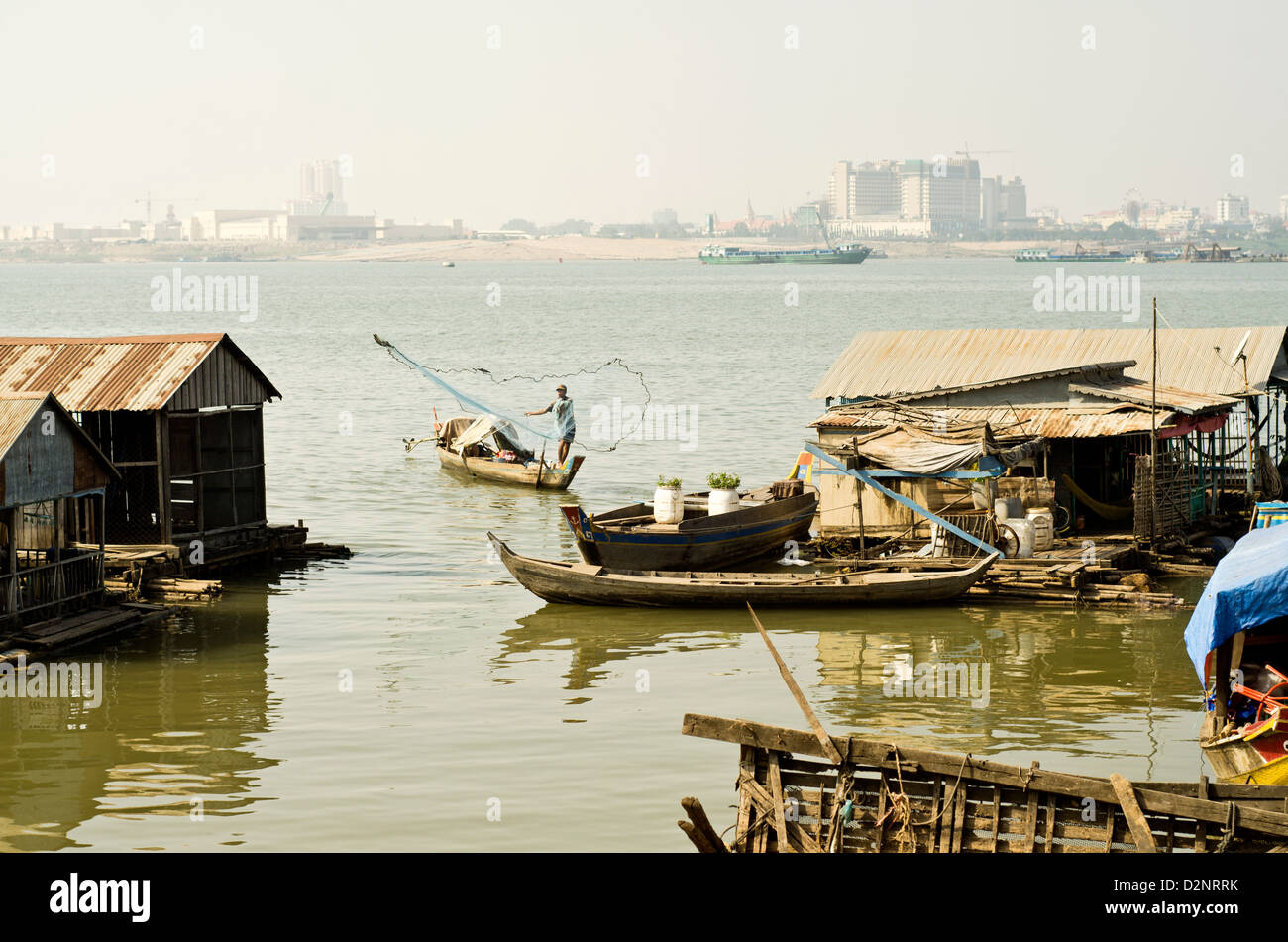 Floating village on the Mekong river in Phnom Penh , 500 meters from some of the most expensive city hotels. Stock Photo