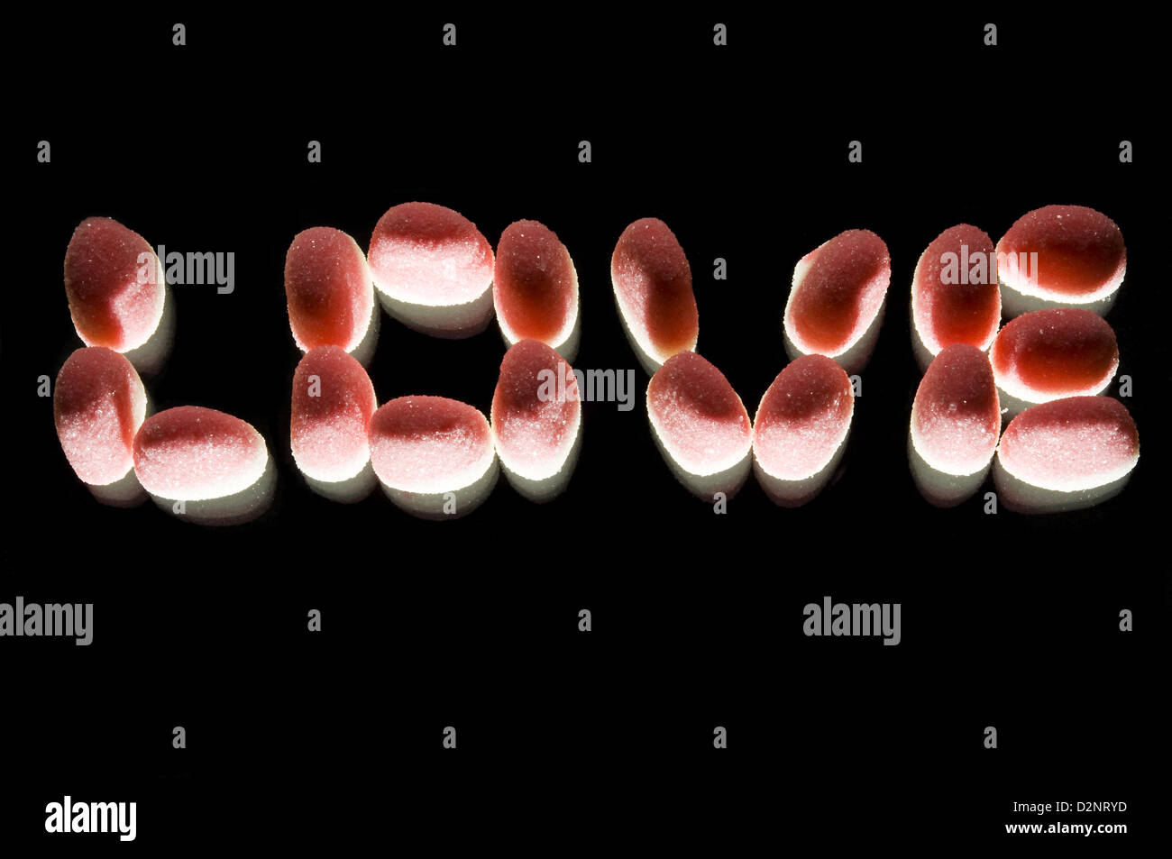 sugarcoated jubes spelling love in studio setting Stock Photo Alamy