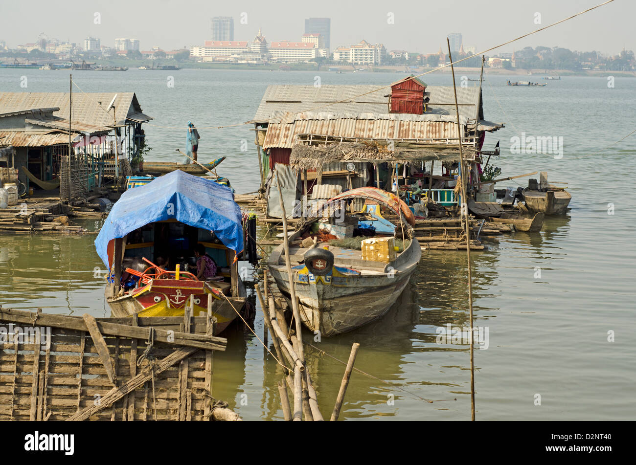 Floating village on the Mekong river in Phnom Penh , 500 meters from some of the most expensive city hotels. Stock Photo