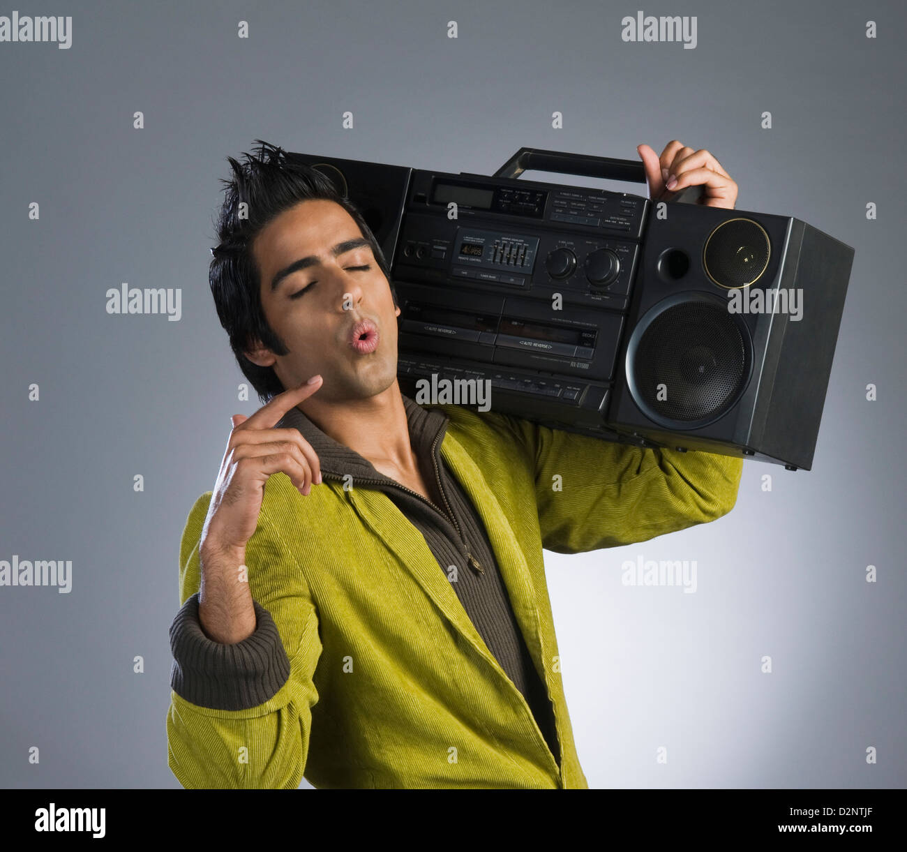 Man listening to a music system and whistling Stock Photo