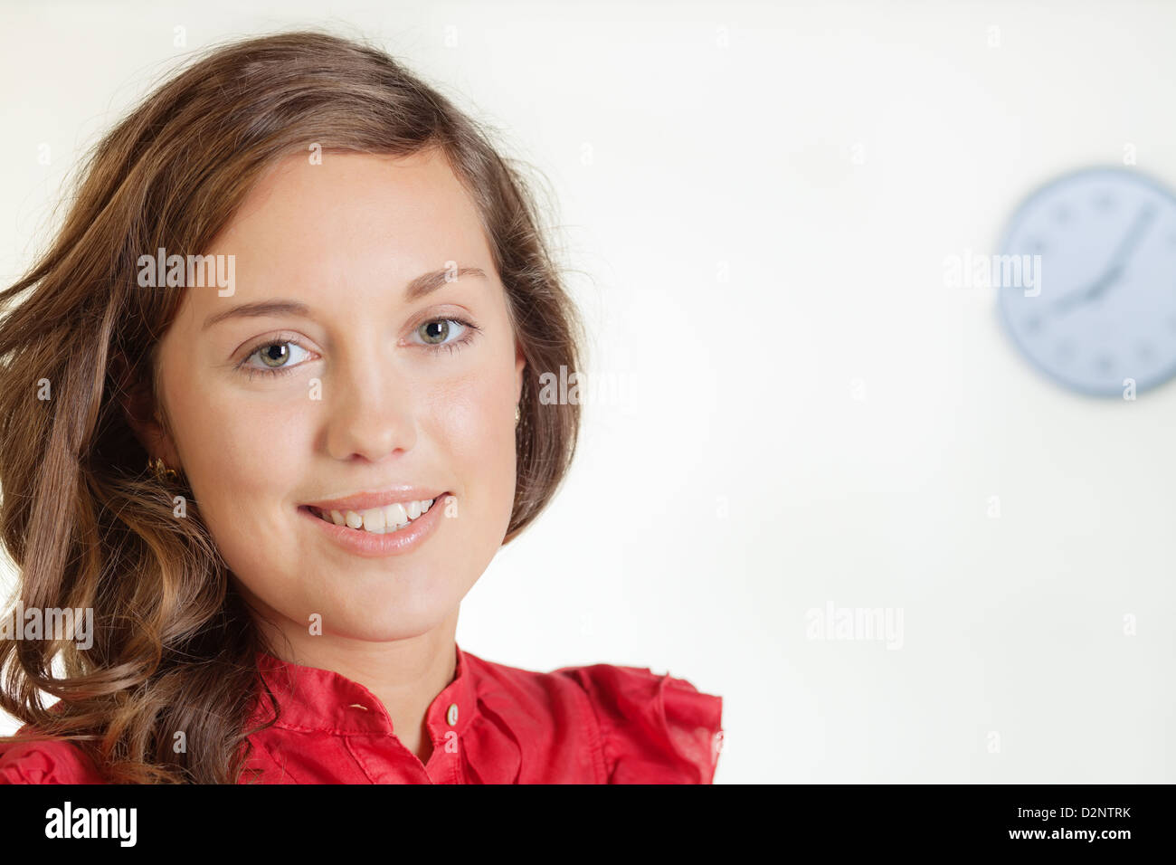 Portrait of pretty young blond woman in red dress Stock Photo
