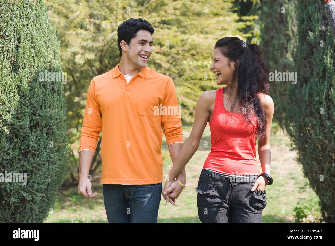 Park couple smile walking hi-res stock photography and images - Alamy