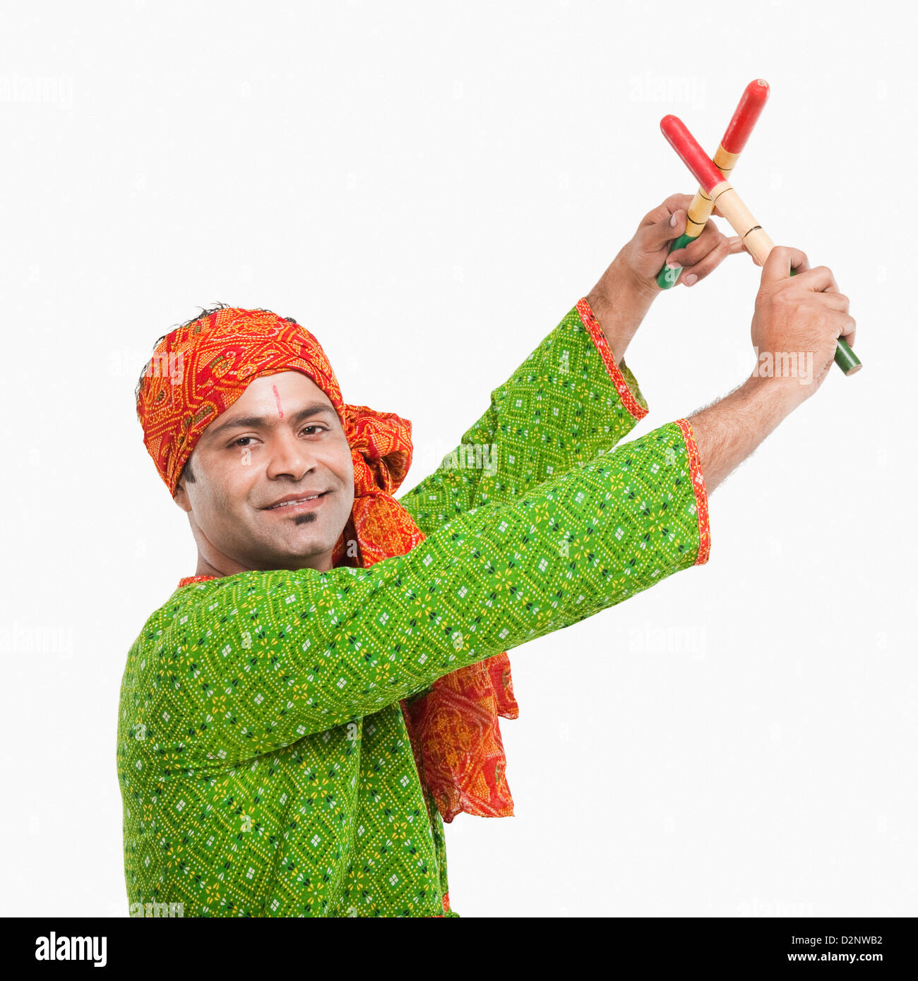 Portrait of a man performing dandiya Stock Photo