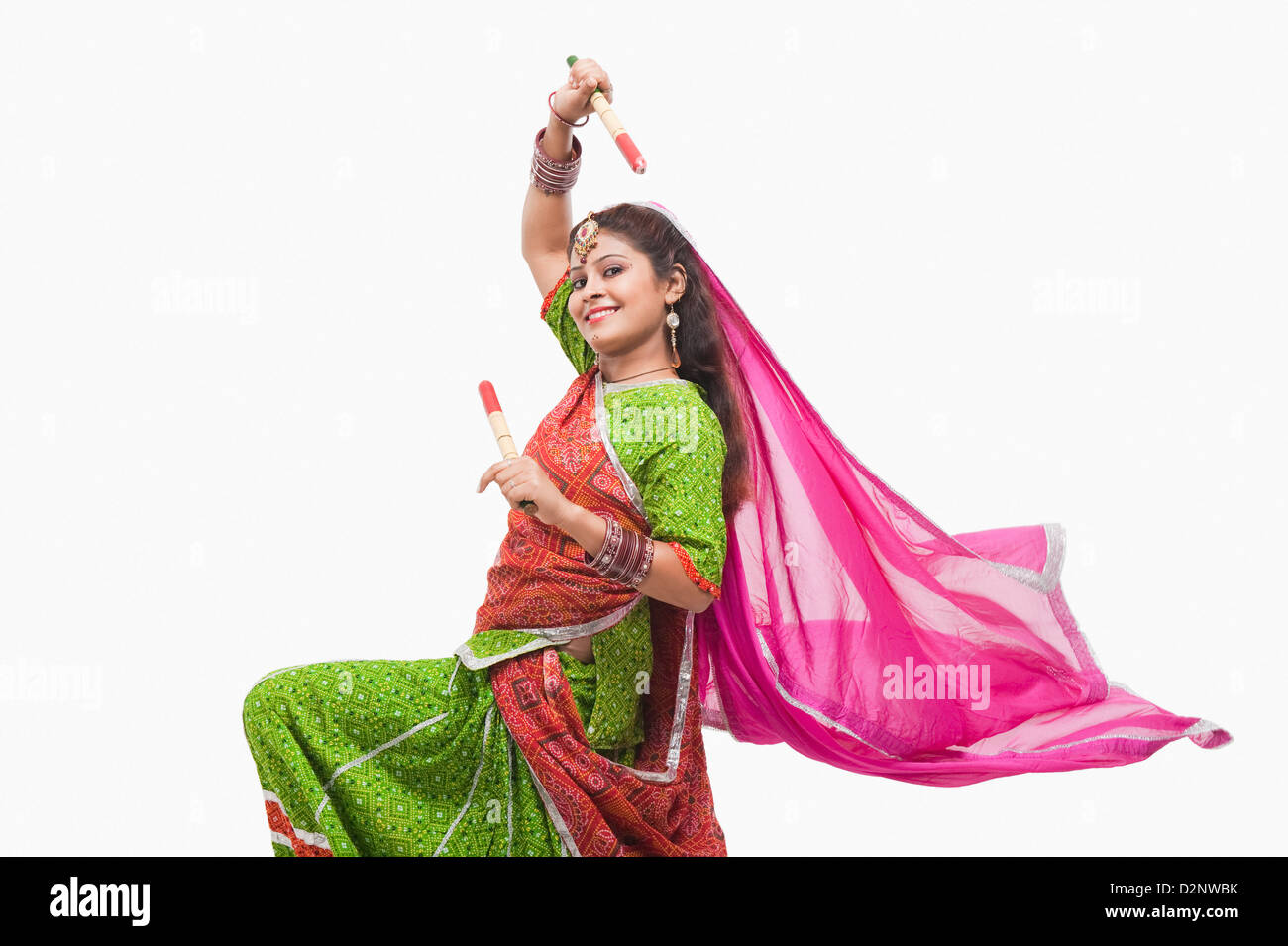 Woman performing dandiya Stock Photo - Alamy