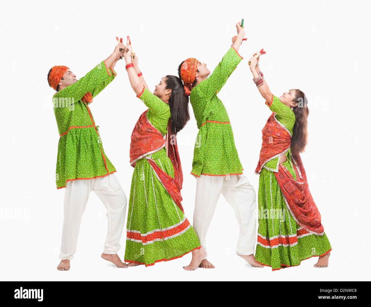 Couples performing dandiya Stock Photo - Alamy