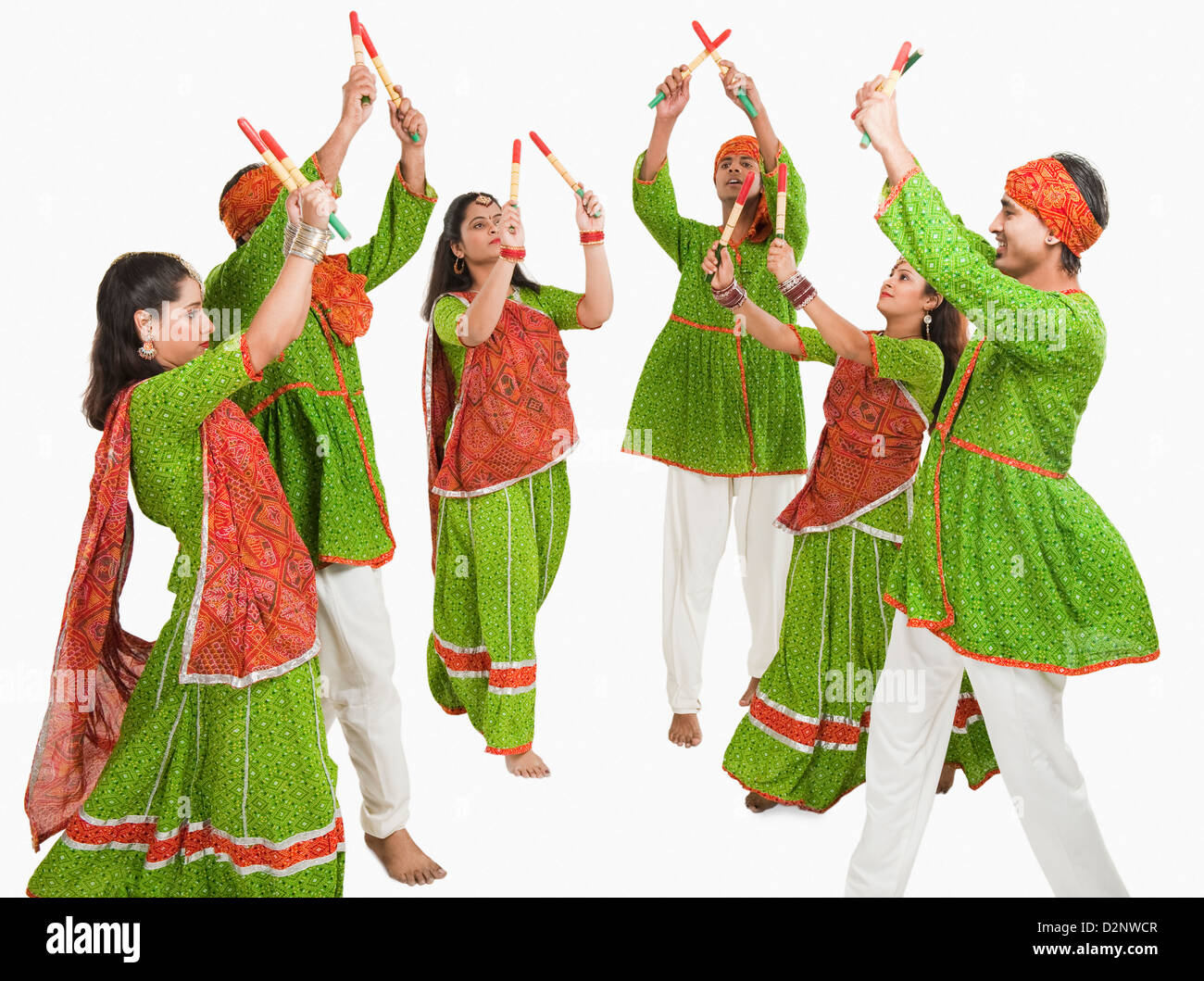 Couples performing dandiya Stock Photo - Alamy