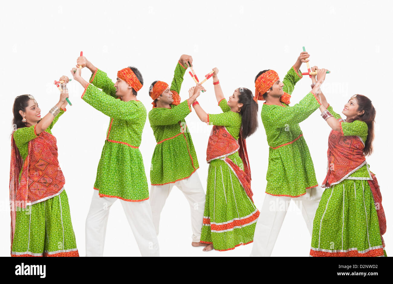 Couples performing dandiya Stock Photo - Alamy