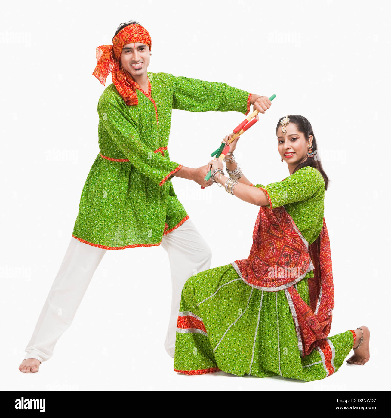 Couple performing dandiya Stock Photo Alamy