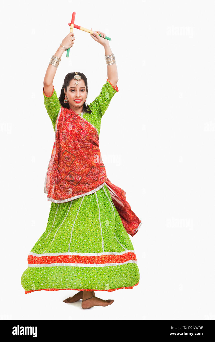 Woman performing dandiya Stock Photo - Alamy
