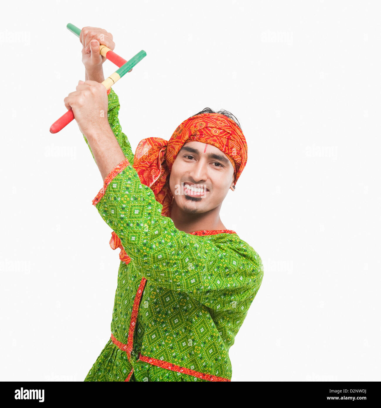 Portrait of a man performing dandiya Stock Photo