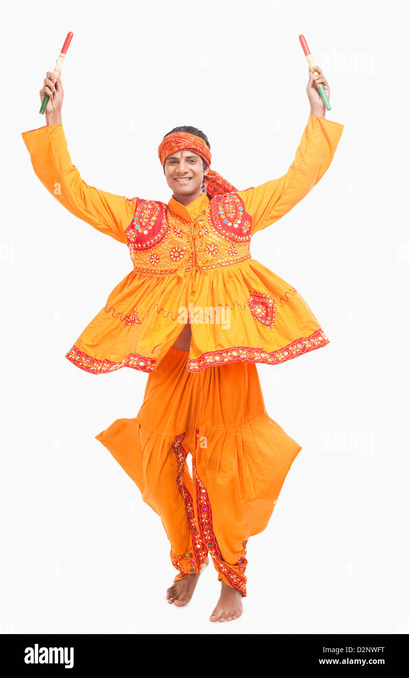 Man performing dandiya Stock Photo