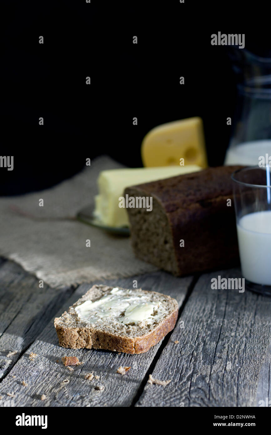 Slice of bread on vintage wooden boards abstract concept Stock Photo ...