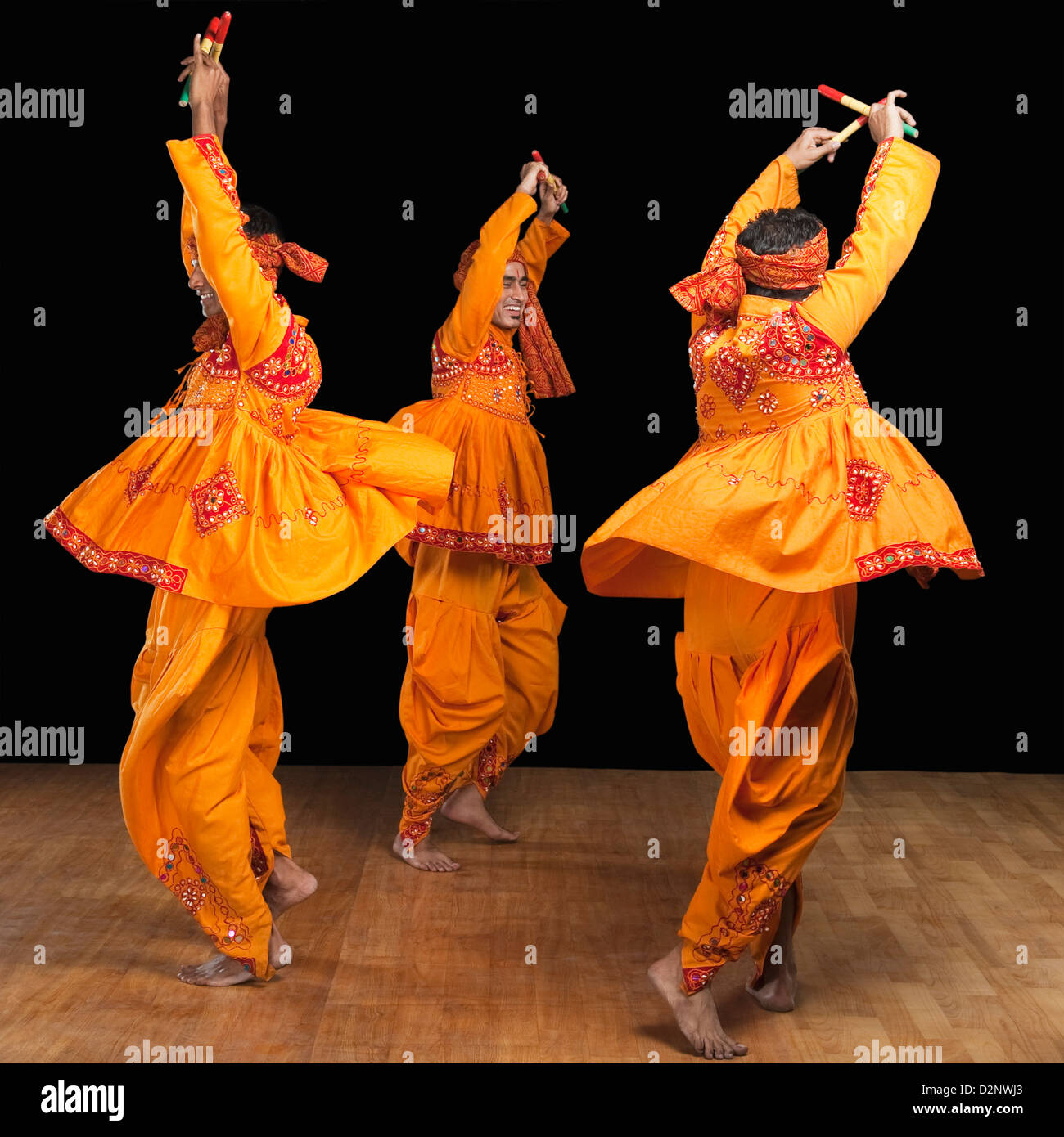 Men performing dandiya Stock Photo - Alamy