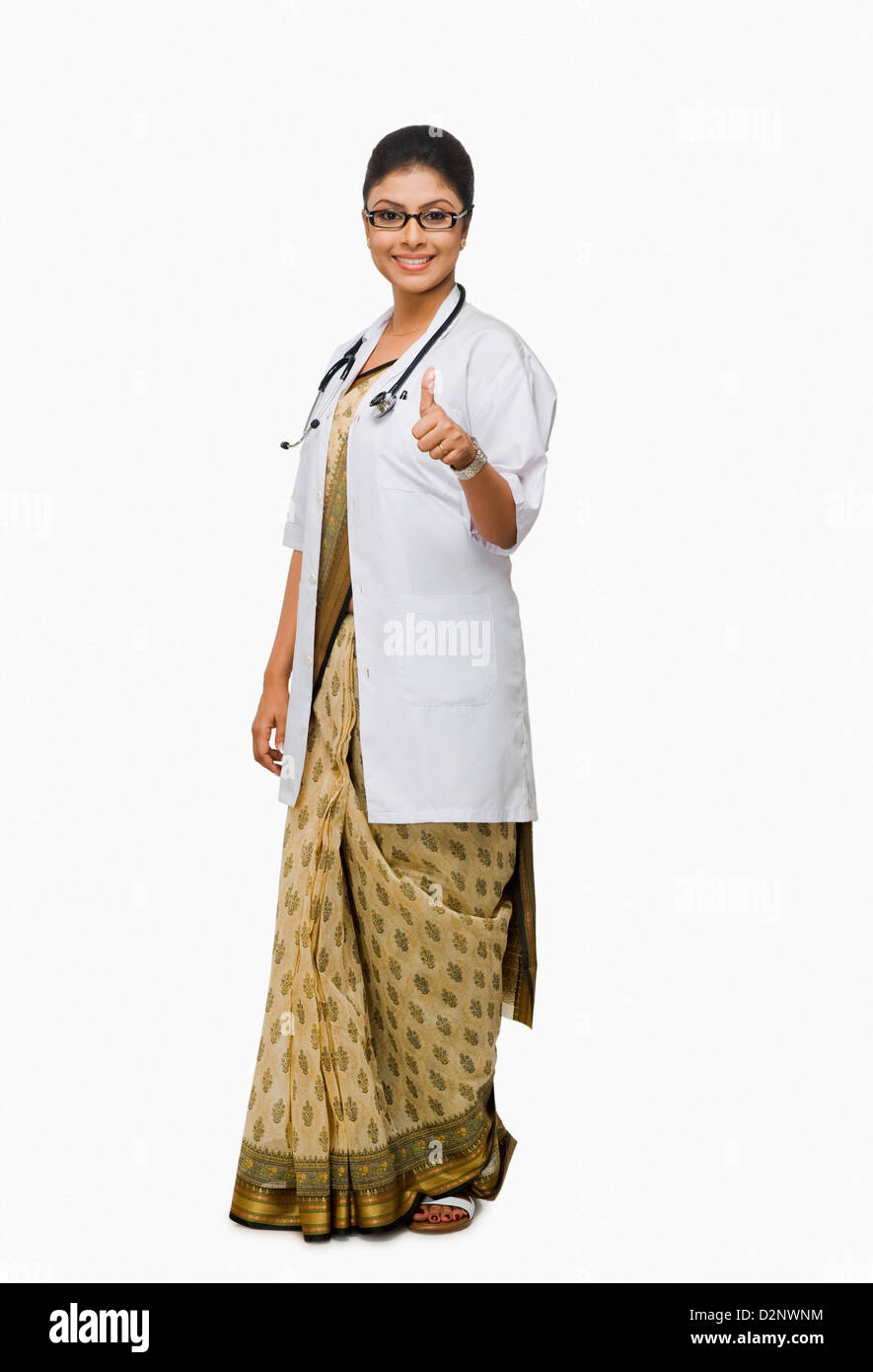 Portrait of a female doctor showing thumbs up sign Stock Photo - Alamy