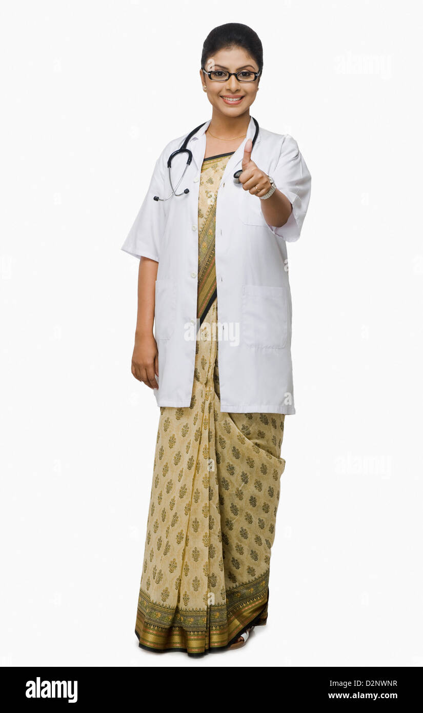 Portrait of a female doctor showing thumbs up sign Stock Photo - Alamy