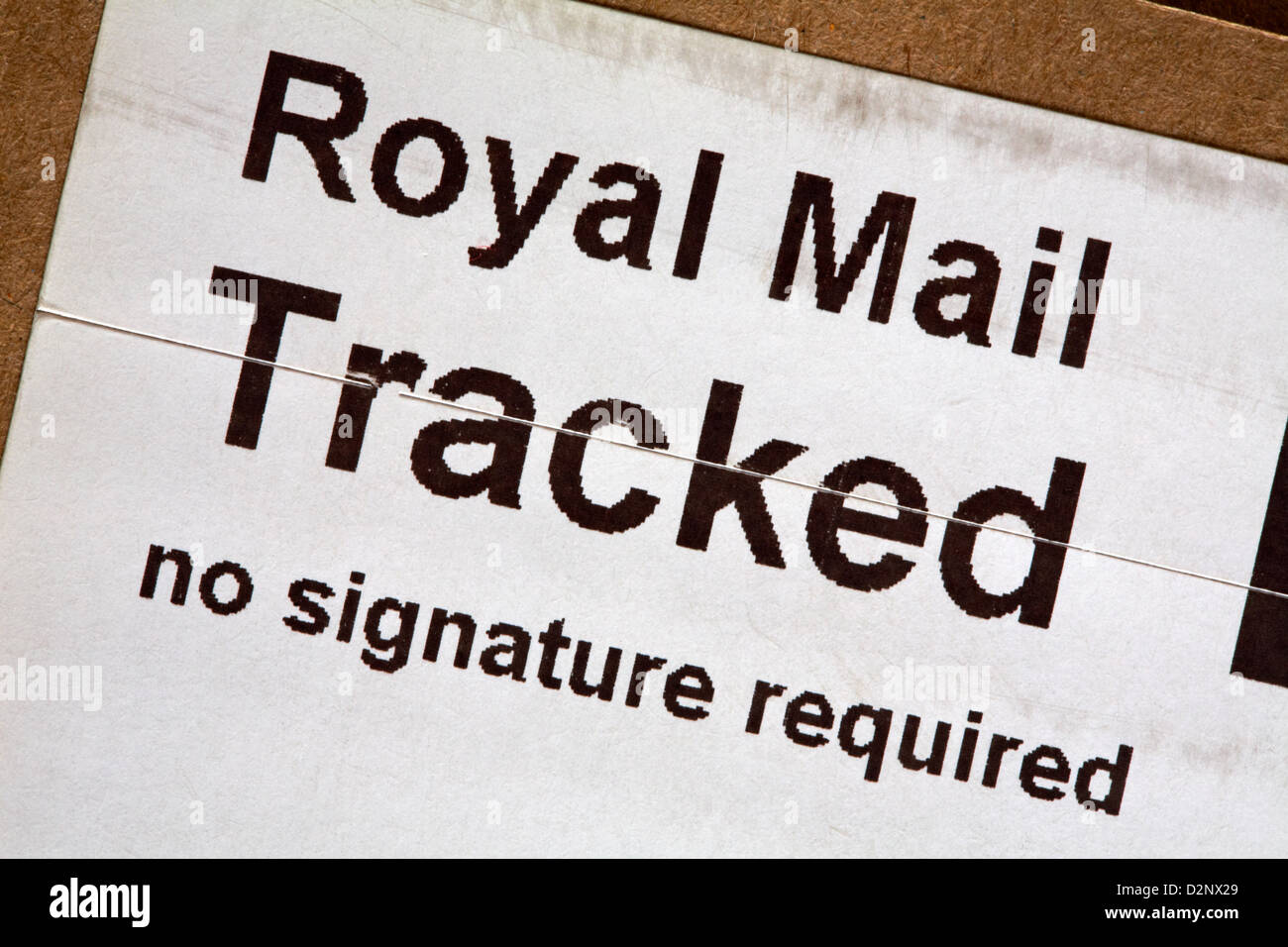 Royal Mail tracked no signature required label on parcel Stock Photo