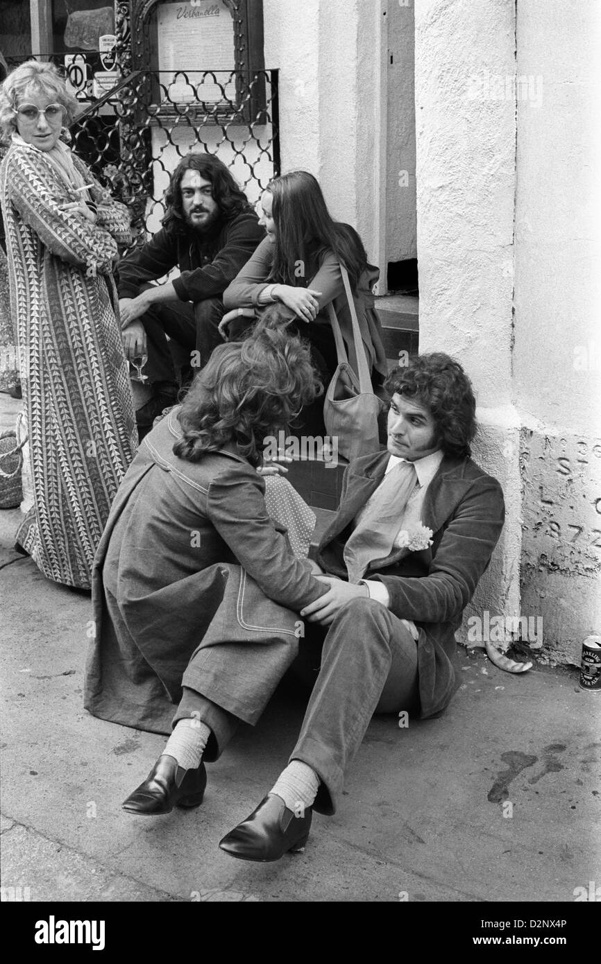 1970s fashion. Fashionable young things in the 70s. Men with long hair. Beauchamp Place Knightsbridge London SW3 UK HOMER SYKES Stock Photo