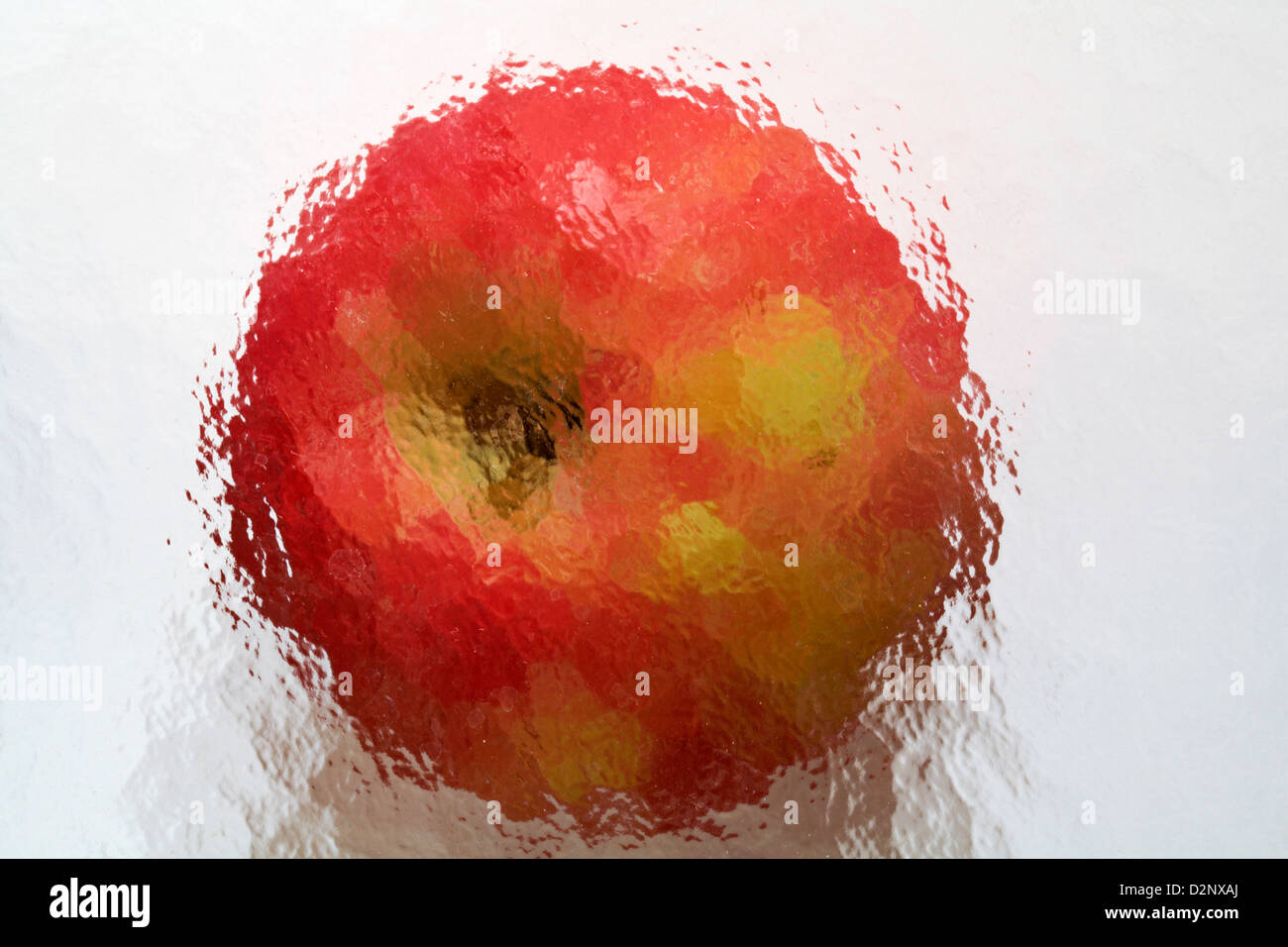 apple impressions red apple on white background under patterned glass