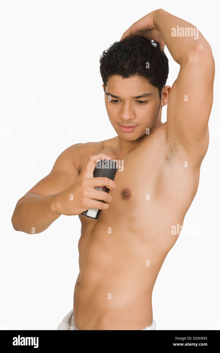 Man applying deodorant Stock Photo Alamy