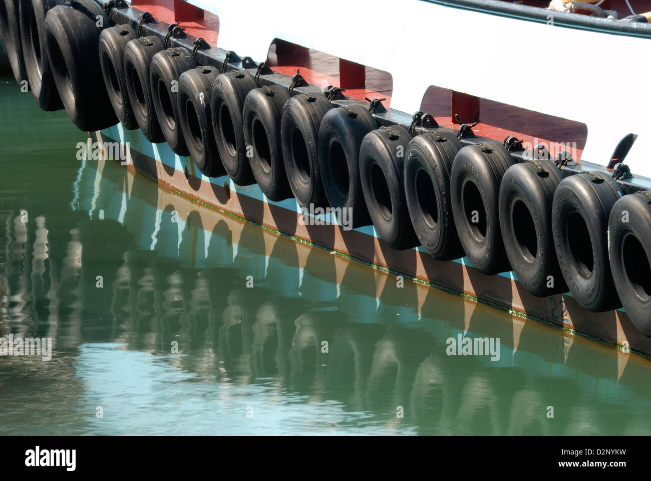 Tyres (tires) as fenders on side of tug boat in Portsmouth harbour