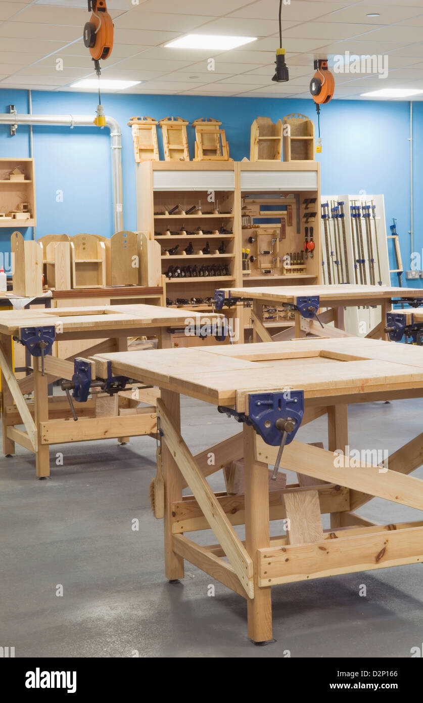 A woodworking classroom with workbenches in a modern secondary school