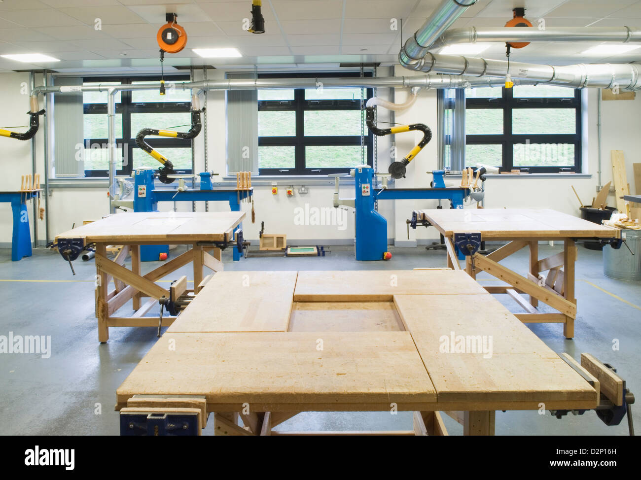 A woodworking classroom with workbenches in a modern secondary school