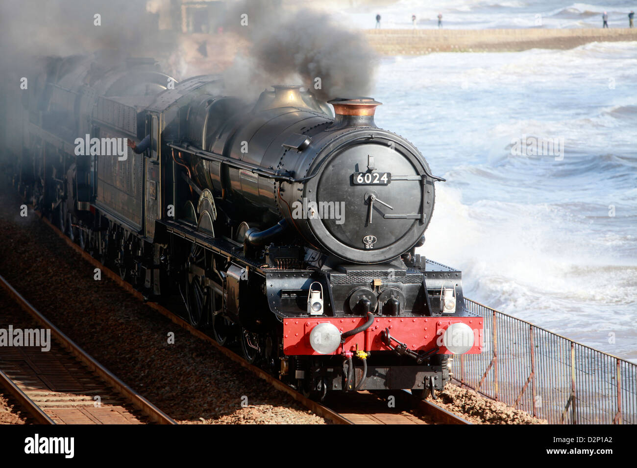 A vintage double header steam passes through Dawlish on the