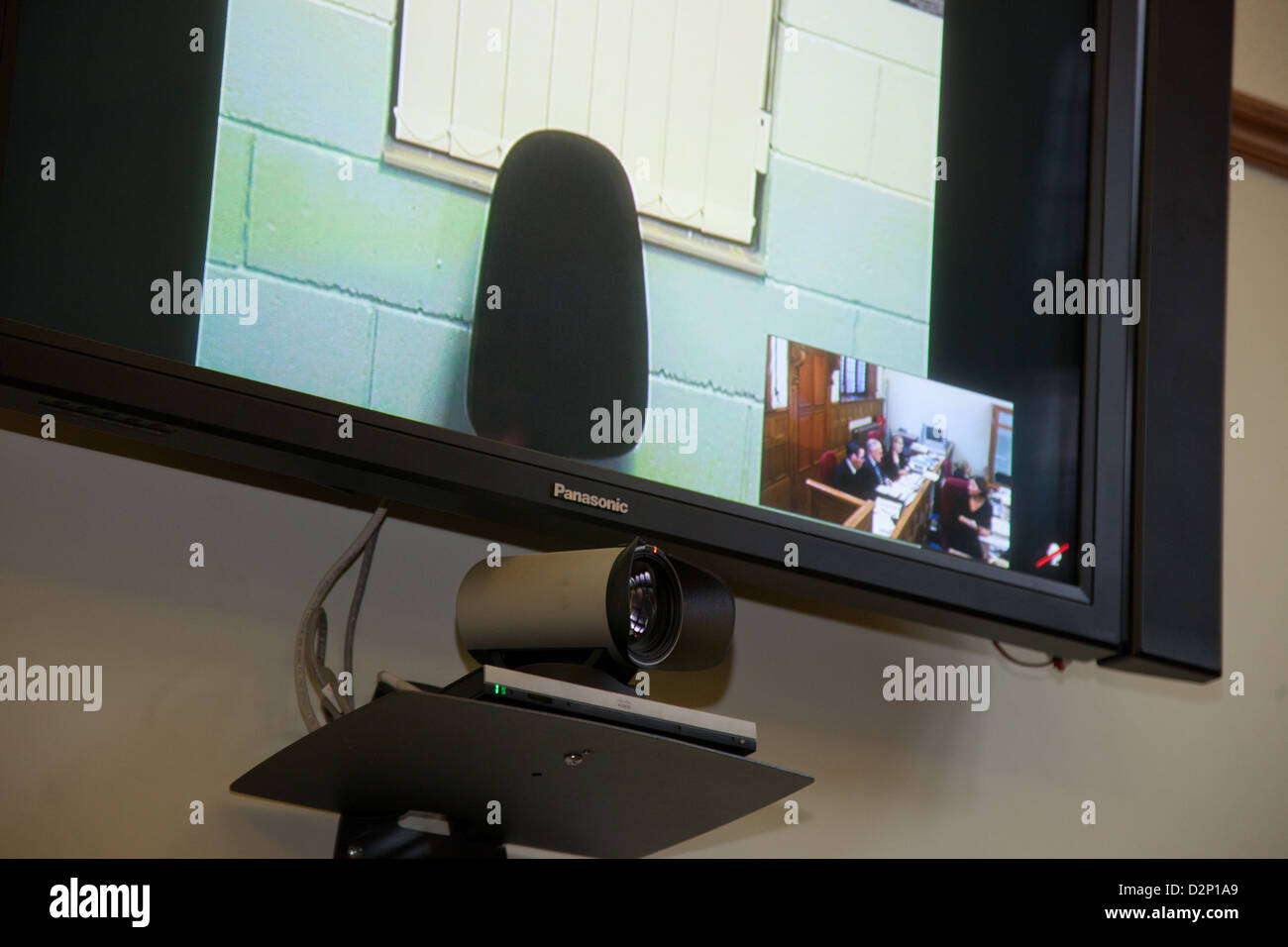 Video link up technology in a court room Stock Photo Alamy