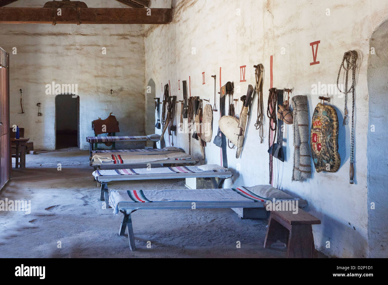 Bunkhouse or sleeping room with cots and riding tack and personal belongings of Spanish at Mission La Purisima State Historic Stock Photo