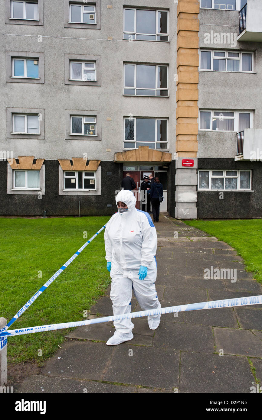 Reading, Berkshire, UK. 30th January 2013.  Following the discovery of the body of a 50 year old man in Reading at 7am this morning, police have sealed off an apartment block at the junction of Northumberland Avenue and Hartland Road in Whitley, while forensic investigations take place. A forensic investigator is shown leaving the flats. Image © Danny Callcut Stock Photo