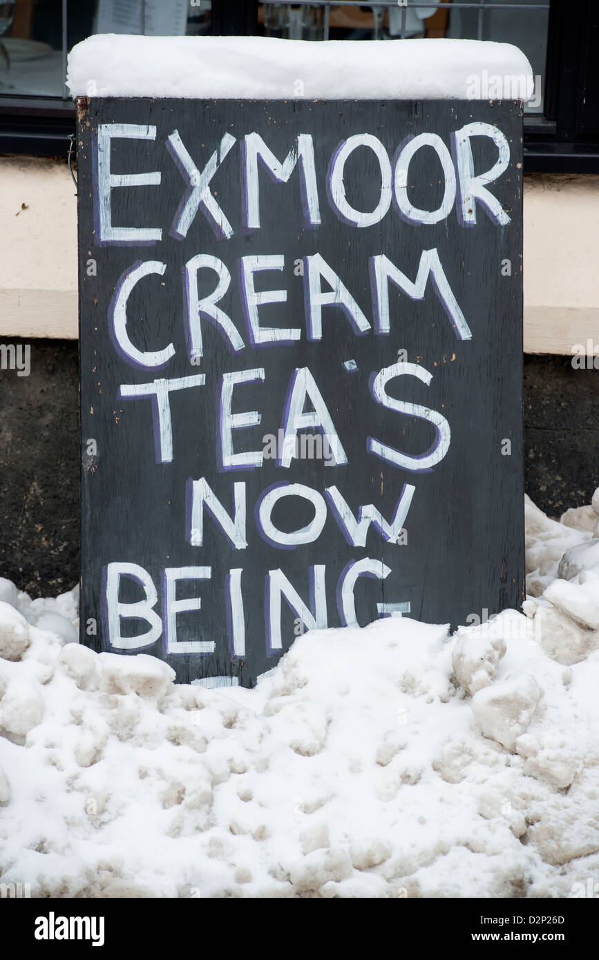 Cream teas for sale covered in snow in winter, Exford, Somerset, UK Stock Photo