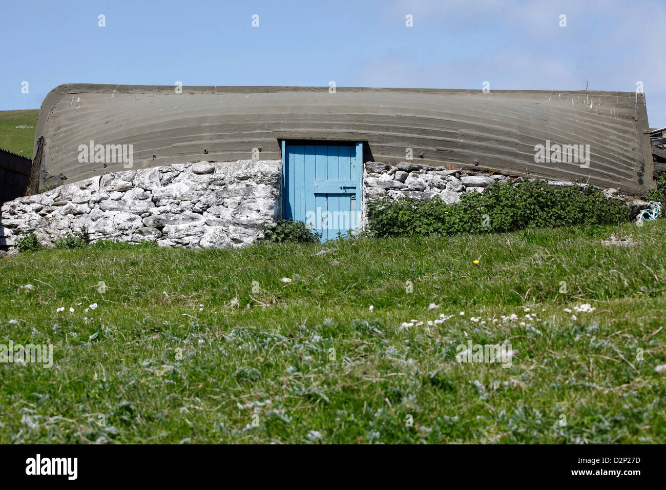 Barn with a roof made from a boat in the tiny settlement of Skaw on the island of Unst. Stock Photo