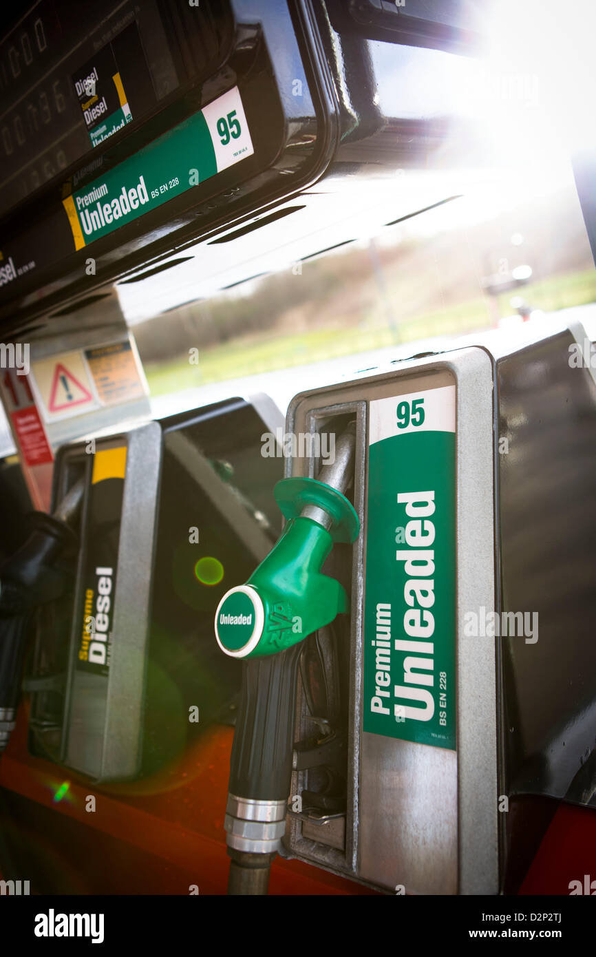 A close up view of a unleaded petrol pump with sun flare. Stock Photo
