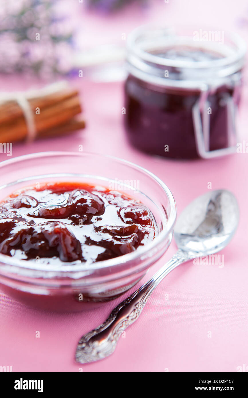 sweet plum jam in glass vessels, closeup Stock Photo