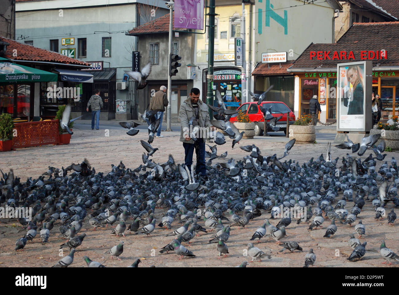 Man with pigeons in Baščaršija, Old town in Sarajevo Stock Photo