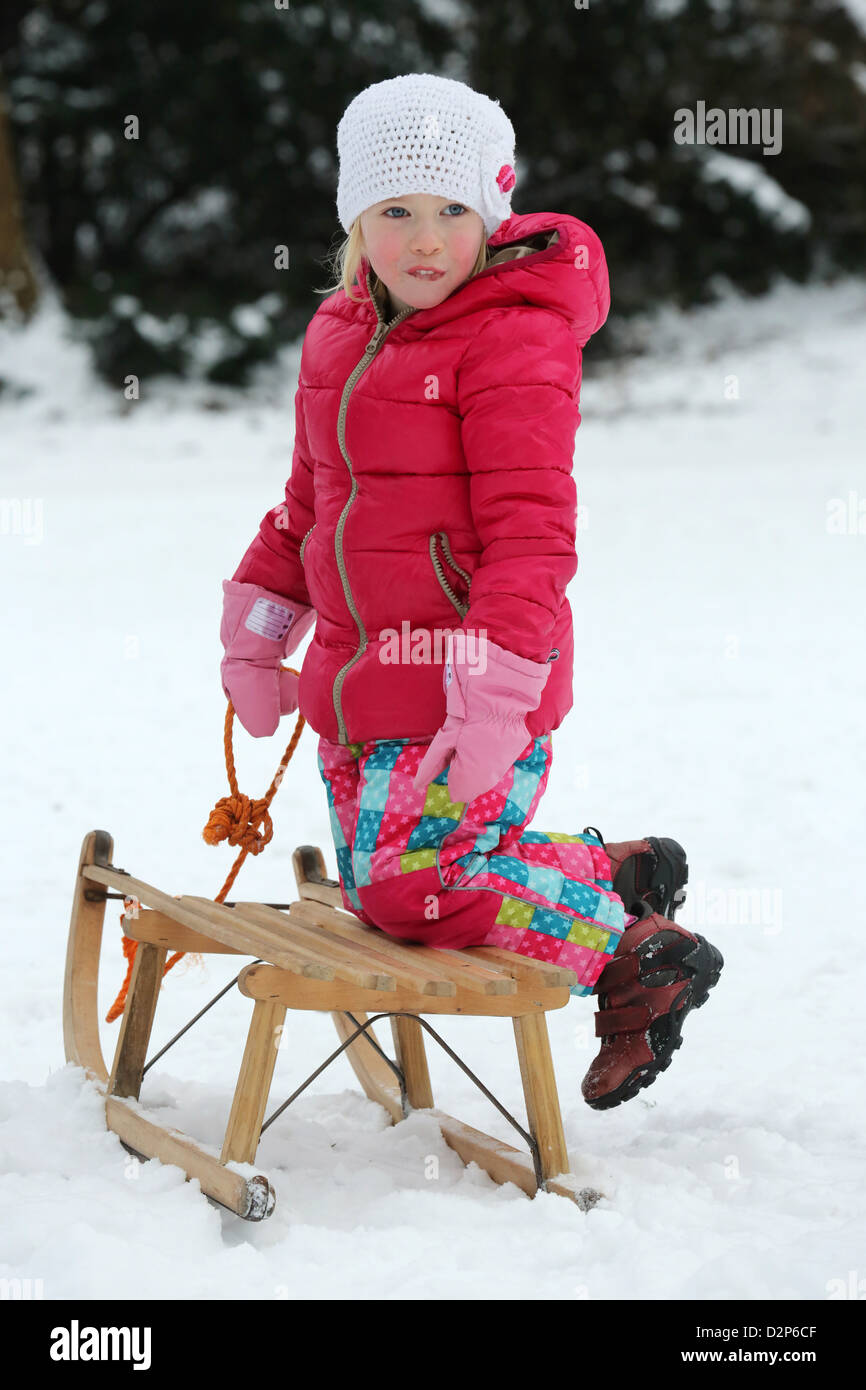 Young girl (4 years) on a sled in Dortmund, Germany Stock Photo