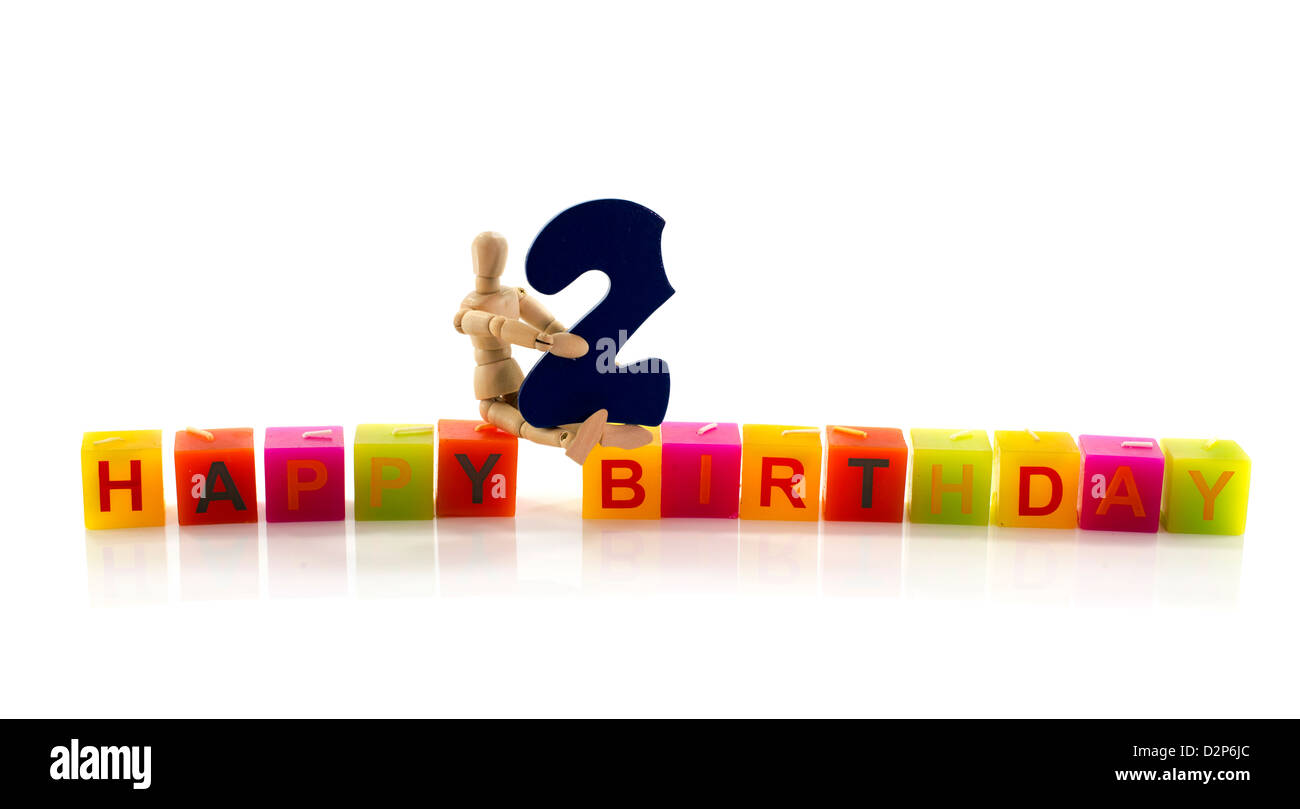 happy birthday candle letters with puppet and the number two Stock Photo