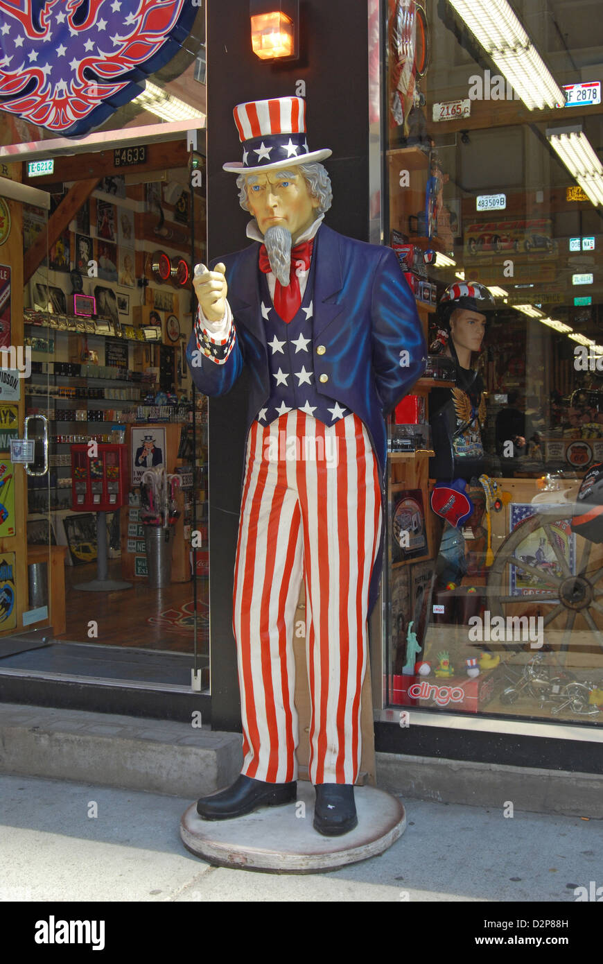 Statue of Uncle Sam with broken finger outside clothing store on