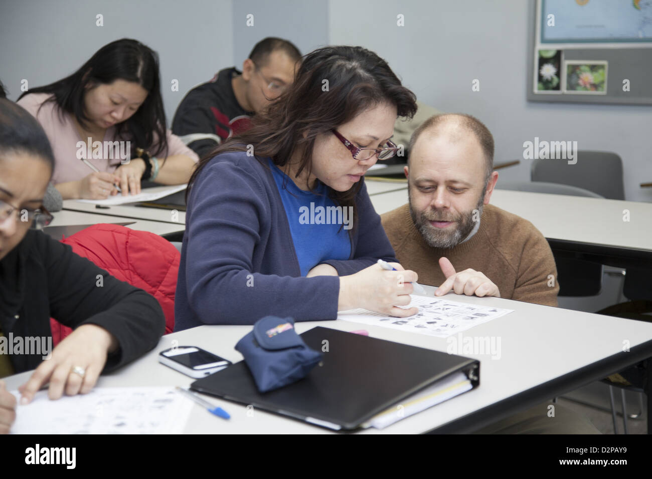 Class for immigrants learn English and prepare themselves for employment opportunities. NYC Stock Photo