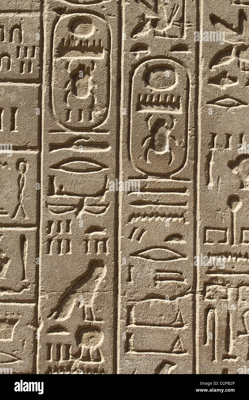 Ancient Egypt hieroglyphs carved on the stone Stock Photo - Alamy