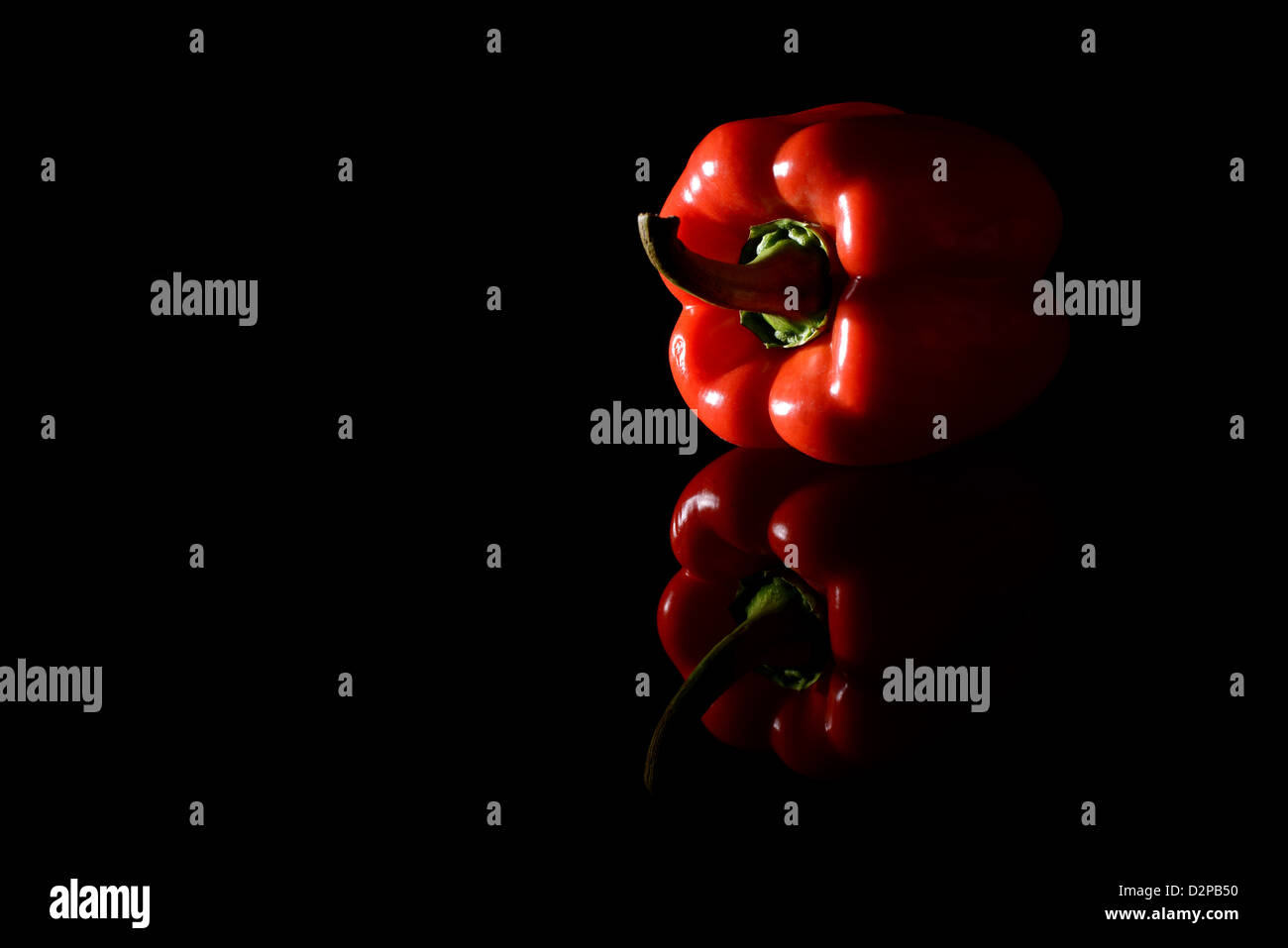 Red pepper or Capsicum on a black background. Studio shot Stock Photo