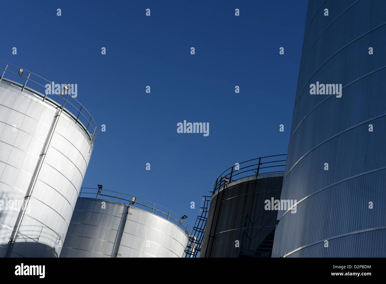 storage tanks at an industrial production plant and processing facility Stock Photo
