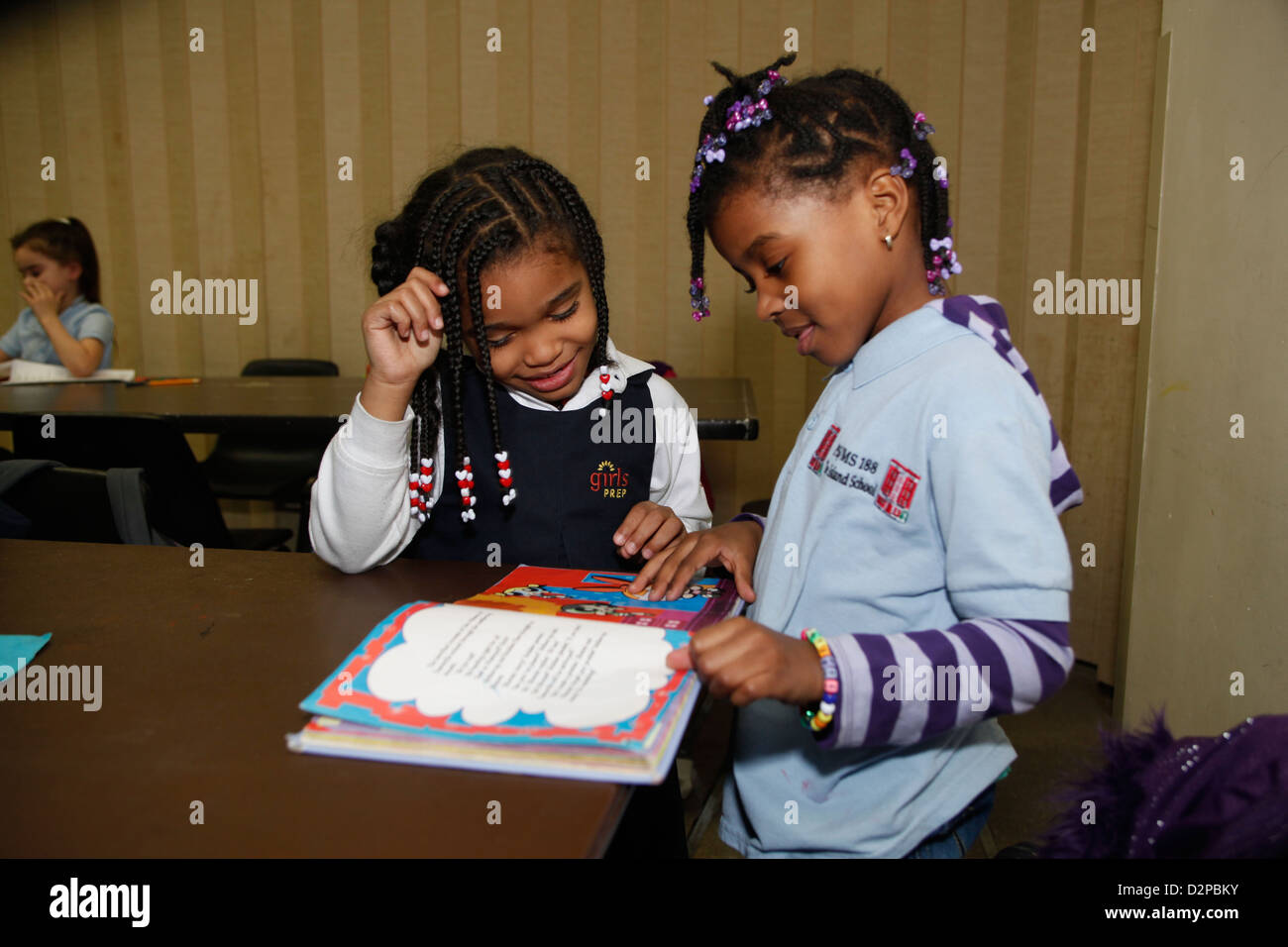 Children participate in an after school homework & education program on the Lower East Side, NYC Stock Photo