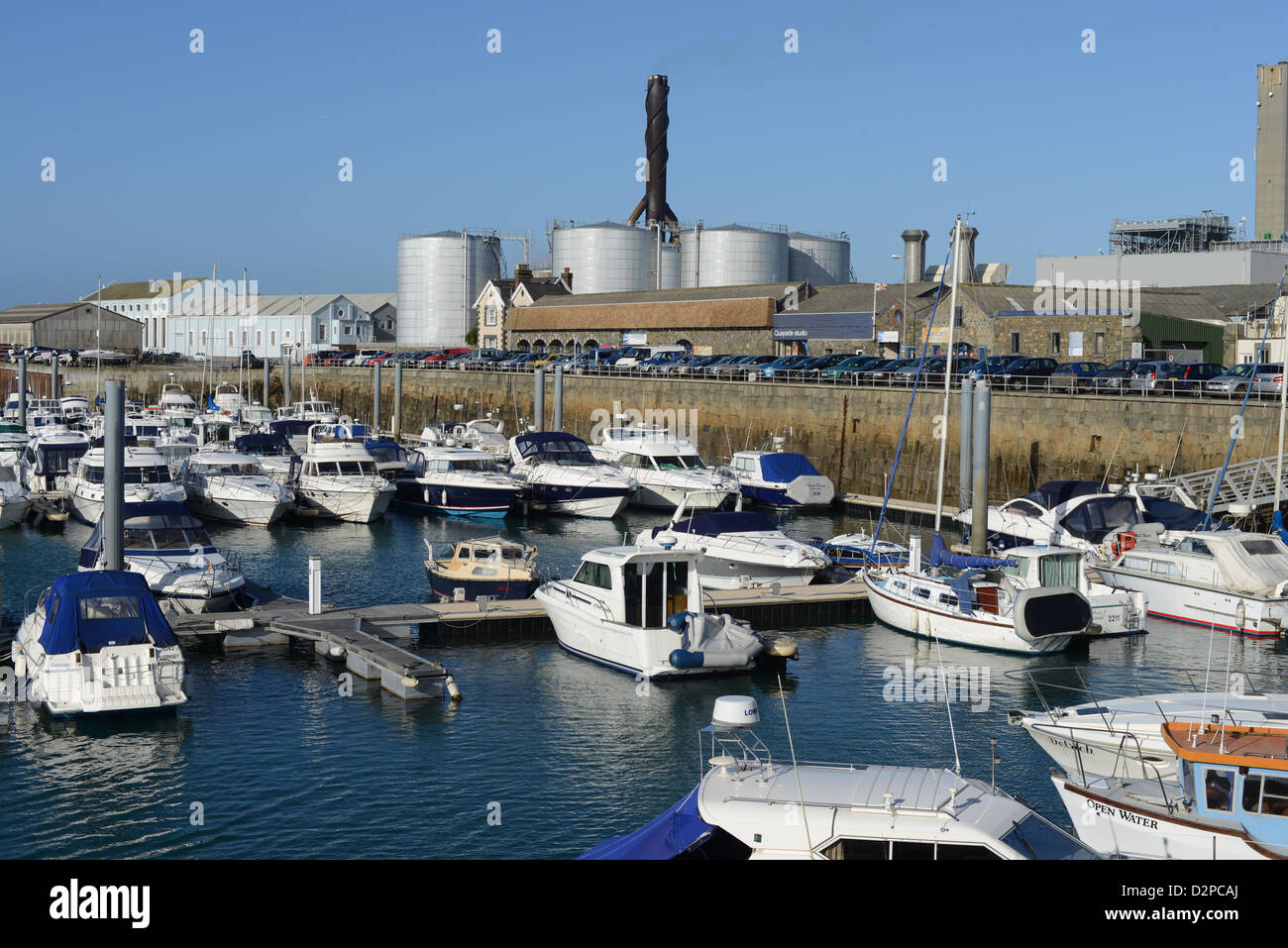 Boats in harbour overlooked by Guernsey Electric power station, St