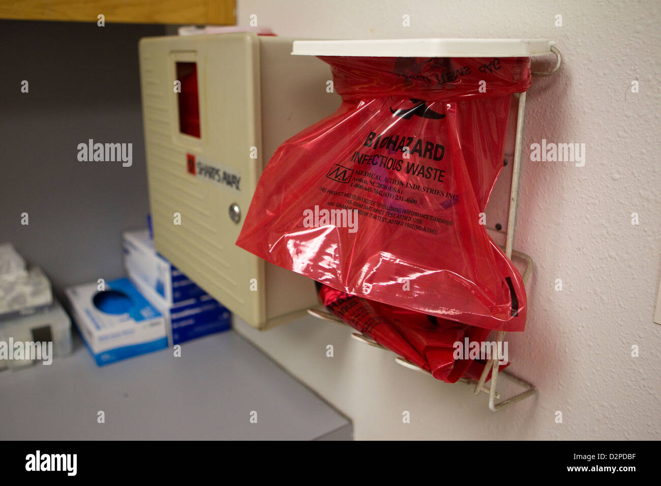 Red bag marked at biohazard infectious waste at small medical clinic in Austin, Texas Stock Photo