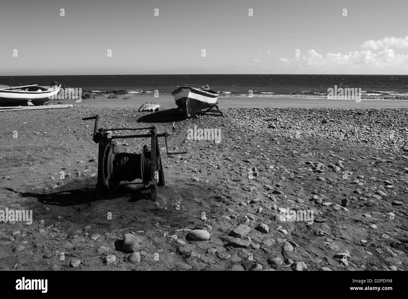 View of  old fishing boat and reel, onto an oceanic beach, Gran Canaria, Canary Islands, Spain Stock Photo