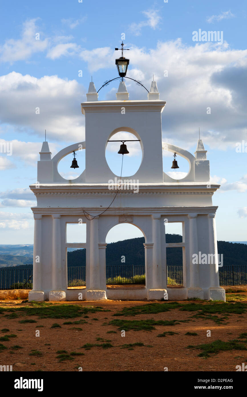 The bell tower of Pena de Arias Montano with view of Sierra de Aracena Stock Photo
